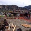 Working on the swimming pool deck behind the clubhouse